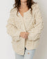 Cream cardigan sweater with pom pom details in heart shape