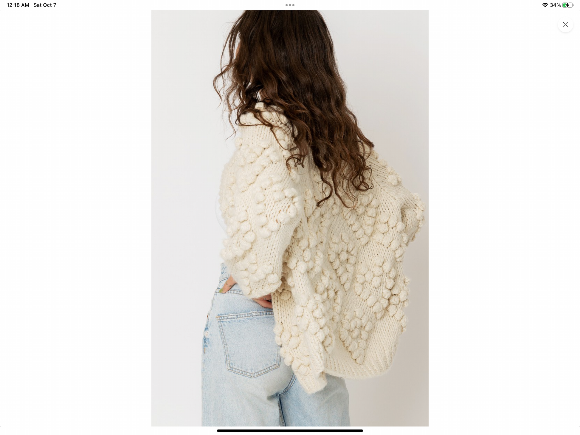 Cream cardigan sweater with pom pom details in heart shape