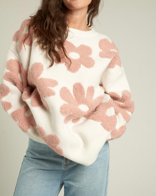 White sweater with large fuzzy pink flowers