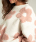 White sweater with large fuzzy mauve pink flowers 